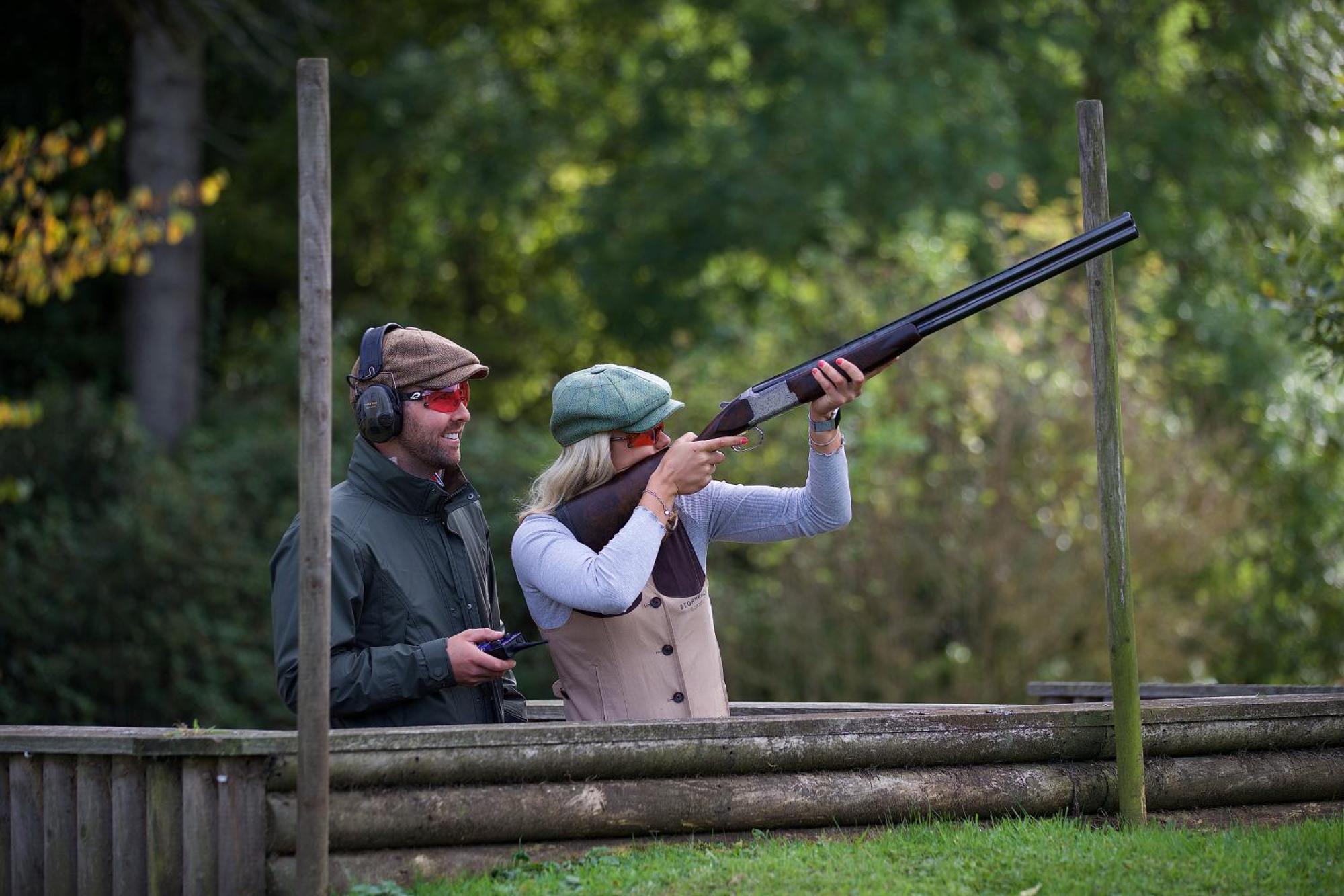 Schloss Roxburghe, Part Of Destination By Hyatt Extérieur photo A woman shooting with a shotgun