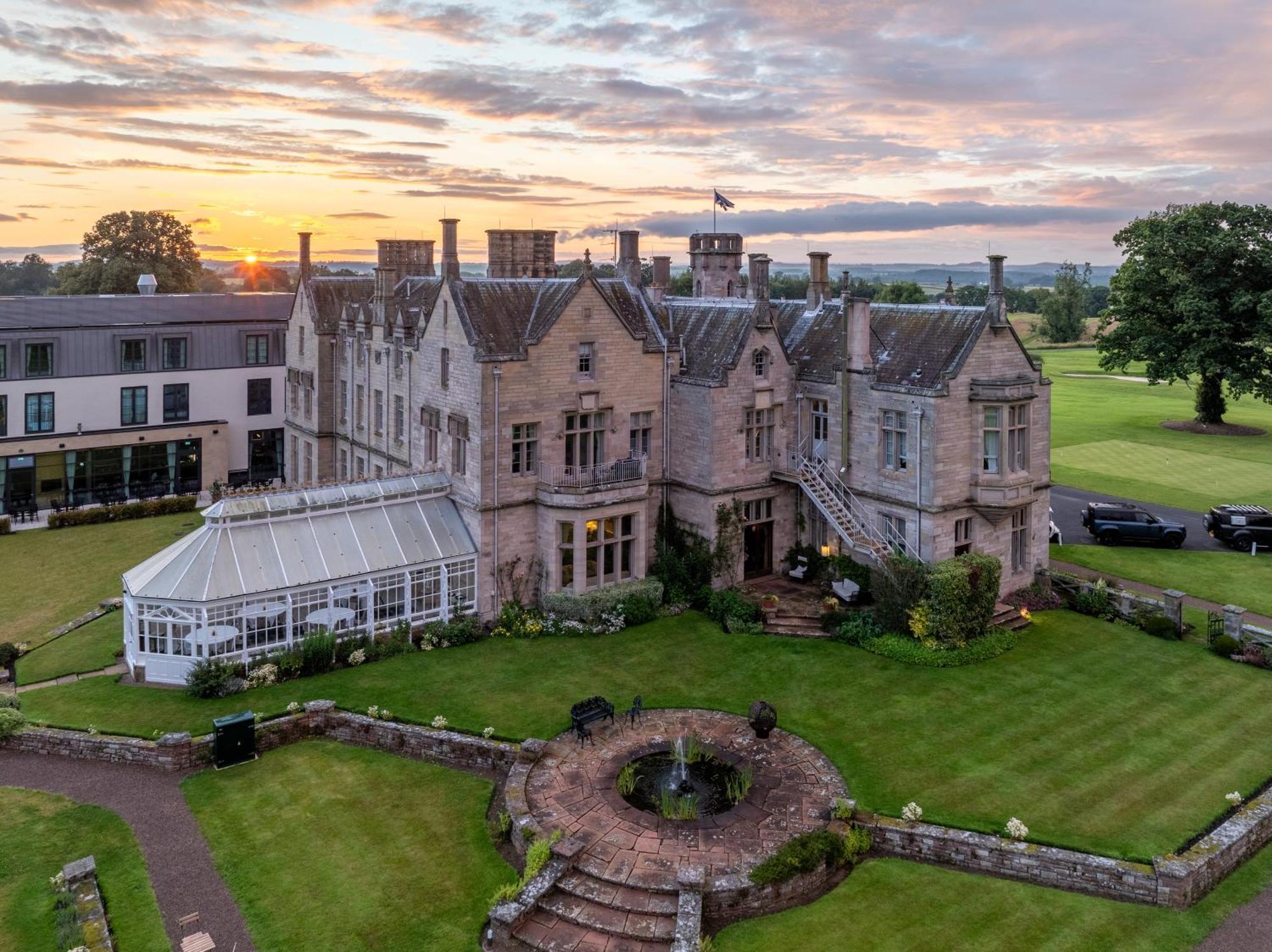 Schloss Roxburghe, Part Of Destination By Hyatt Extérieur photo The hotel at sunset